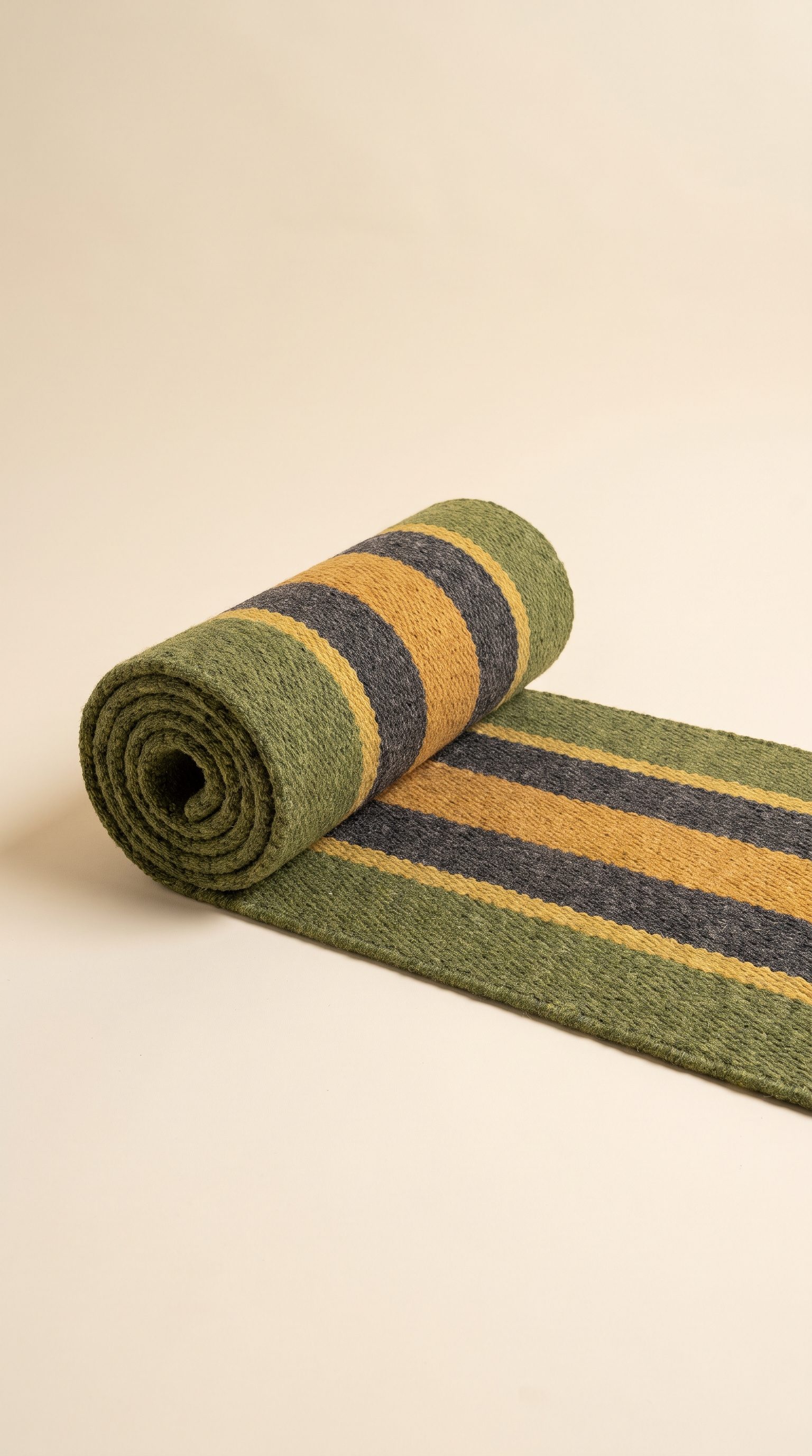 A rolled striped wool hallway runner